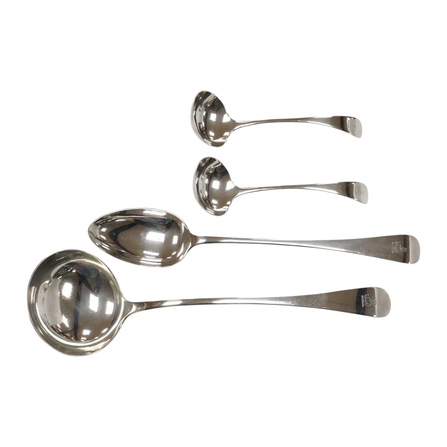 An Edwardian silver Old English pattern soup ladle, basting spoon and pair of sauce ladles, by Martin, Hall & Co, Sheffield, 1905, 19oz. Condition - fair to good